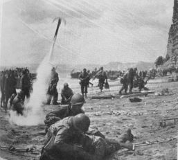 photo of rocket grapnel in use on Omaha Beach